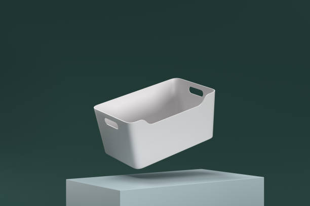 istock A white basket is floating in midair on a green surface 2187595657