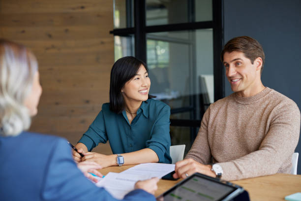 istock Multiethnic couple meeting financial advisor 2187596827