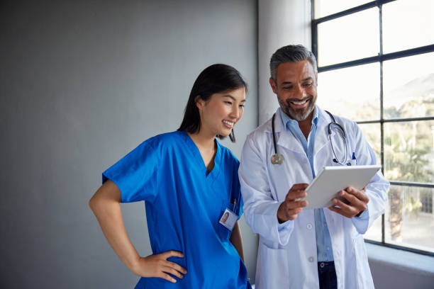 istock MIddle eastern doctor and nurse sharing information on patient case 2187597545