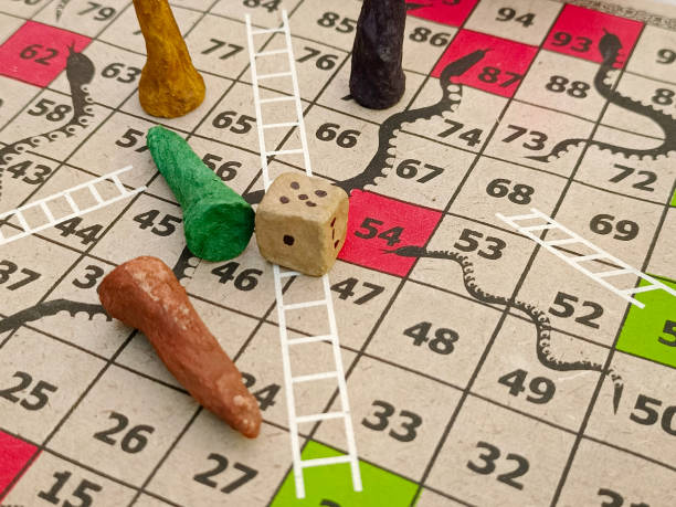 istock Snakes and Ladders, Indian board game, It is played between two or more players on a gameboard having numbered, gridded squares. 2187600774