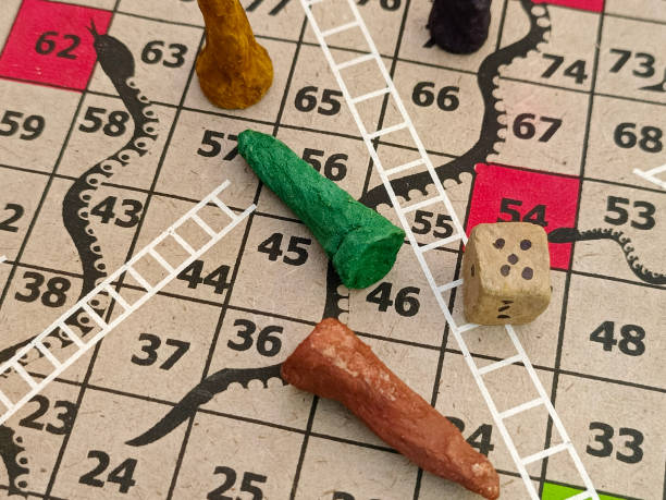 istock Snakes and Ladders, Indian board game, It is played between two or more players on a gameboard having numbered, gridded squares. 2187600781