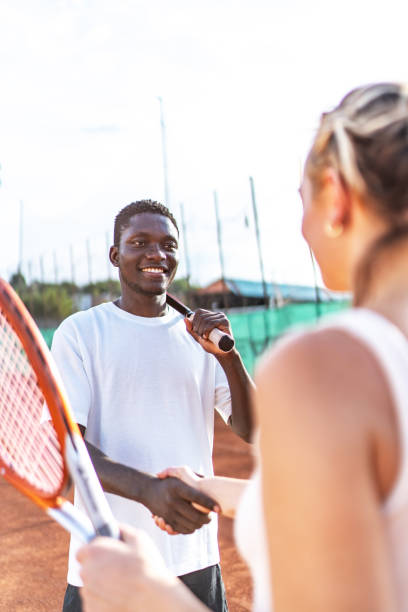 istock Tennis players shaking hands 2187602250