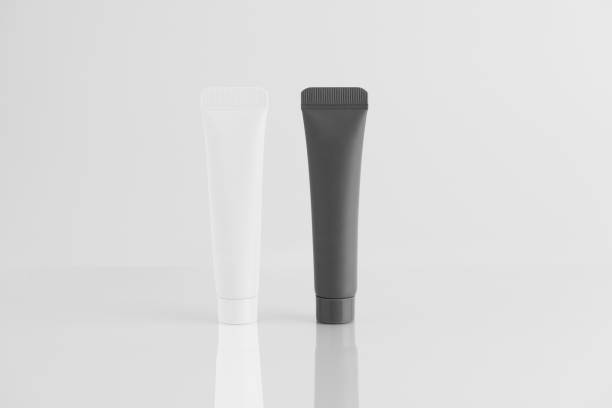 istock White and black cream tube mockup on white isolated background with reflection. Concept of beauty cosmetics, skin care, face mask. 2187606975