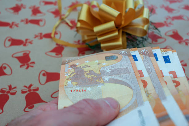euro bills in my hand to buy a Christmas present
