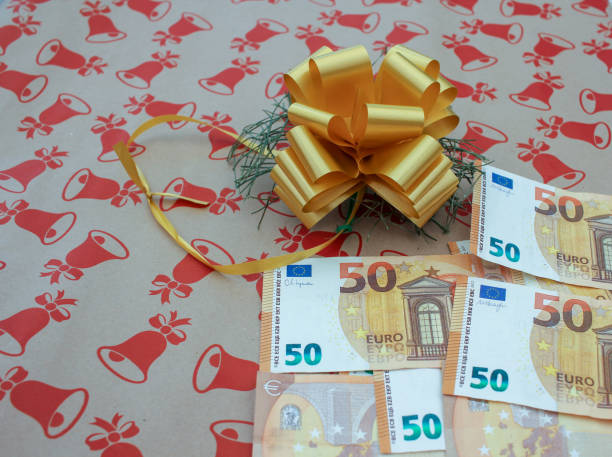 istock euro bills and christmas present 2187609103