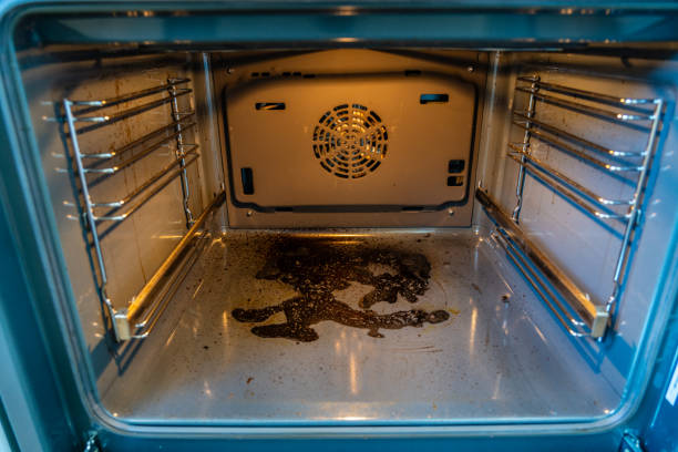 istock Close up inside view of dirty oven with deposits on bottom 2187614775