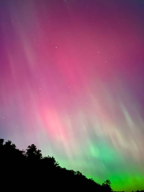 istock Aurora borealis with green and red hues 2187620879