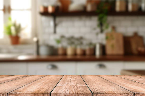 istock Empty Beautiful wood table top and blur bokeh modern kitchen interior background in clean and bright, Ready for product montage 2187623738