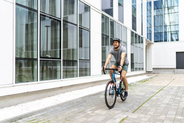 istock Athletic man cycling bicycle in the city 2187624315