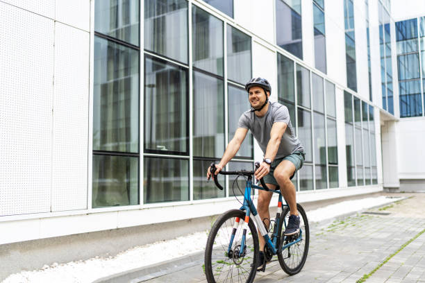 istock Athletic man cycling bicycle in the city 2187627297