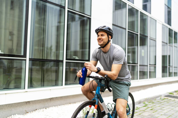istock Cyclist drinking water after ride 2187627750