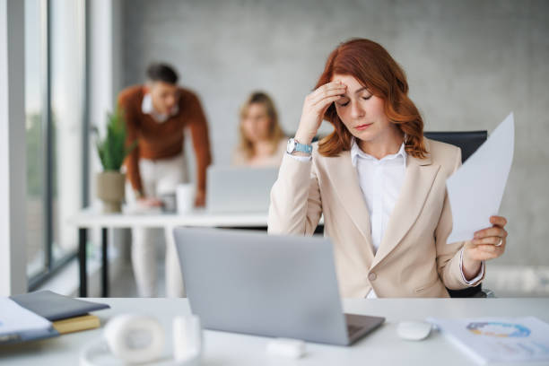 istock Businesswoman Struggling With Stress In Modern Office Environment 2187628376