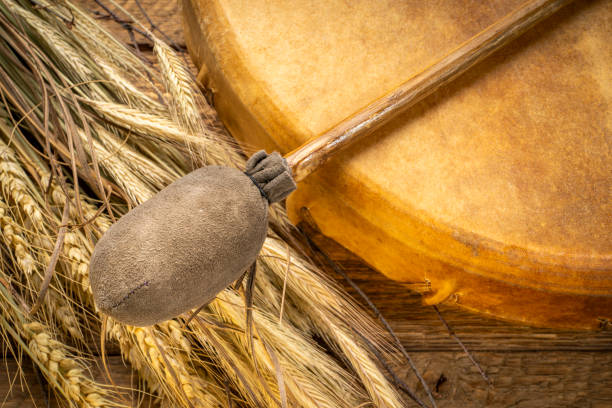 istock handmade, native American style, shaman frame drum with a beater and dried grain stalks 2187632267