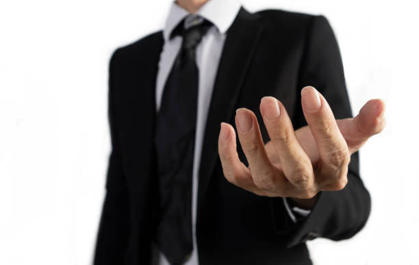 istock Businessman in black suit standing with open hands showing Business project explanation 2187634690