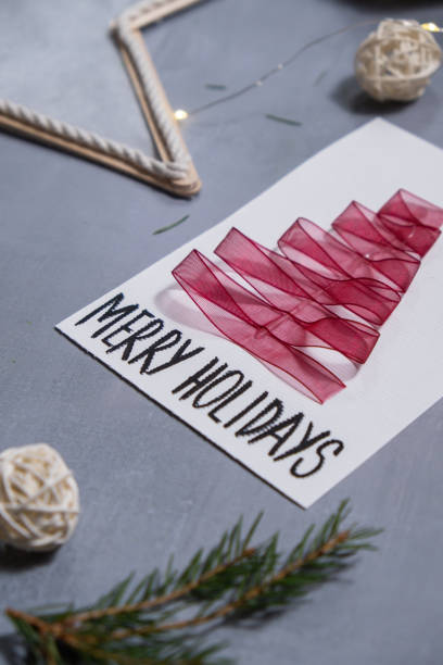 istock Christmas tree ribbon Gift Christmas idea. Do it yourself instruction postcard eco-friendly decoration. Making handmade presents children's diy projects. Holiday family time 2187640131