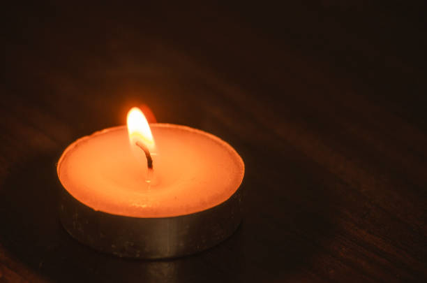 Close up view of a candle light with customizable space for any message or quotes. Candle light and copy space concept