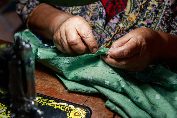 istock Evening sewing routine of an elderly woman 2187640995