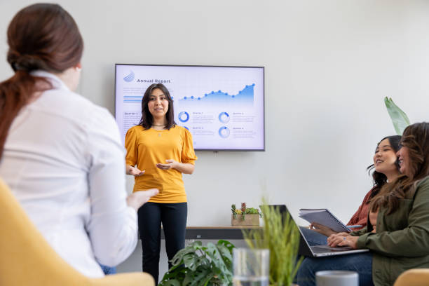 istock An executive conducts a quarterly performance review with the management team. 2187643291