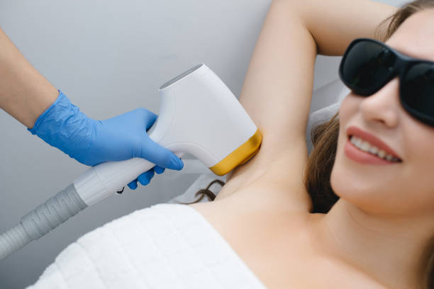 istock young woman on laser epilation procedure 2187643912