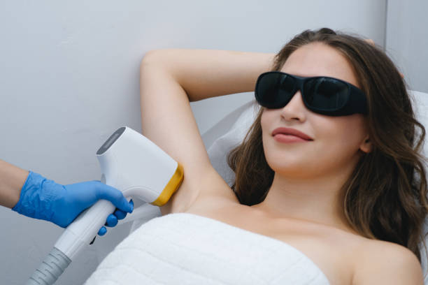 istock young woman on laser epilation procedure 2187643913