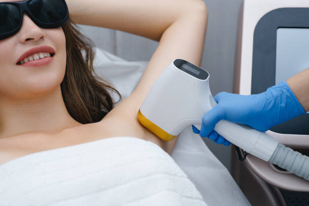 istock young woman on laser epilation procedure 2187643919
