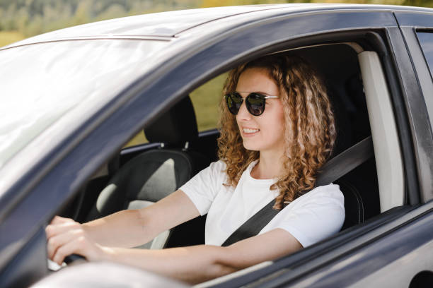 istock young woman in car 2187644102