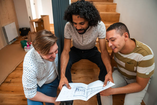 istock Diverse Team Reviews Home Renovation Blueprint 2187646475