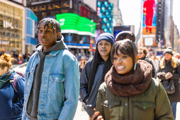 istock Diverse Group of People Walking in Times Square During Daytime 2187646488