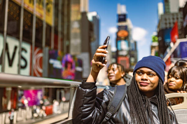 istock Tourists Enjoying a Day Out in Times Square 2187646514
