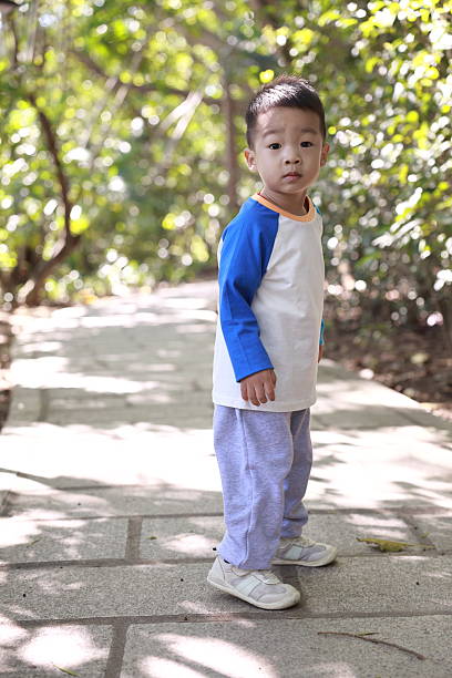 istock Cute children playing in the park 2187647740