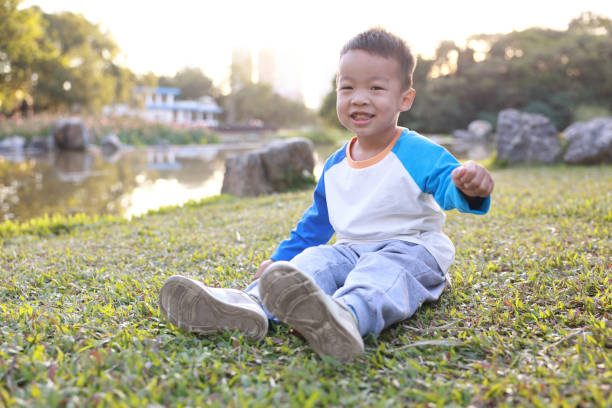 istock Cute children playing in the park 2187648178