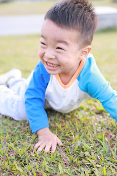 istock Cute children playing in the park 2187648207
