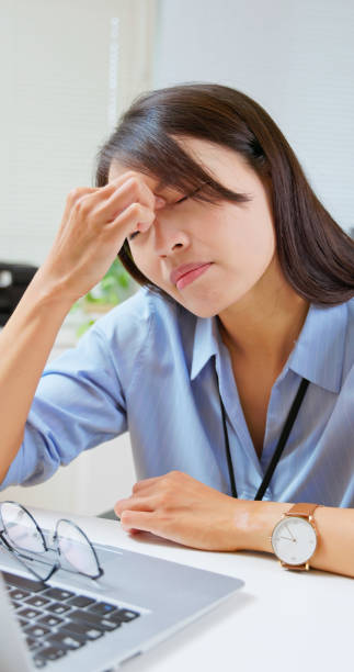 istock woman eyes pain at work 2187648590