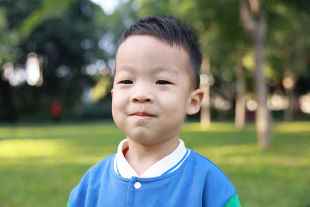 istock Cute children playing in the park 2187649746