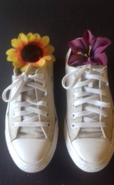 istock Shoes and two flowers 2187650753