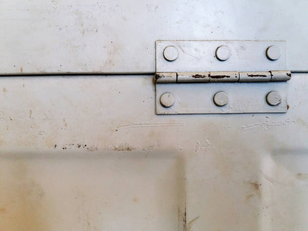 Close up old steel white door or window hinge with copy space. Vintage and Retro object concept.