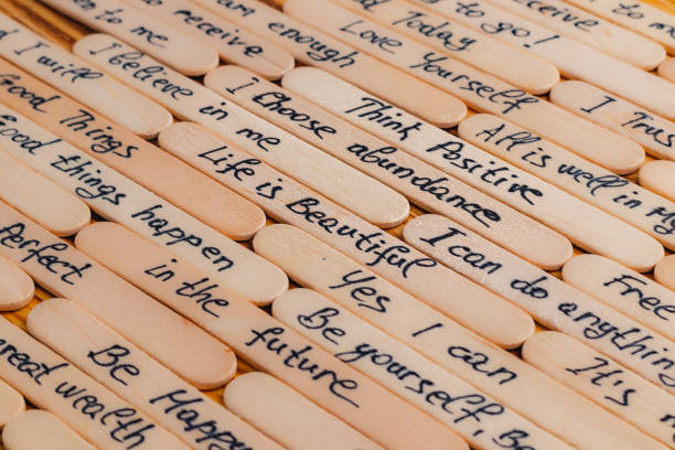 Positive thoughts for increasing selfesteem on wooden posts on wooden background High quality photo.