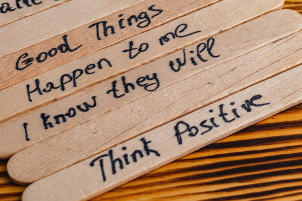 istock Positive thoughts for increasing selfesteem on wooden posts on wooden background 2187652670