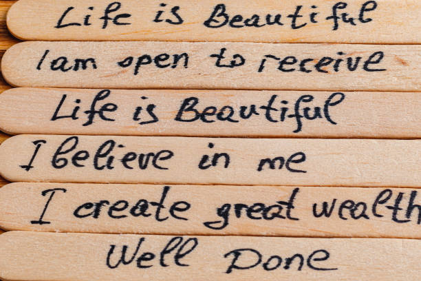 Positive thoughts for increasing selfesteem on wooden posts on wooden background High quality photo.