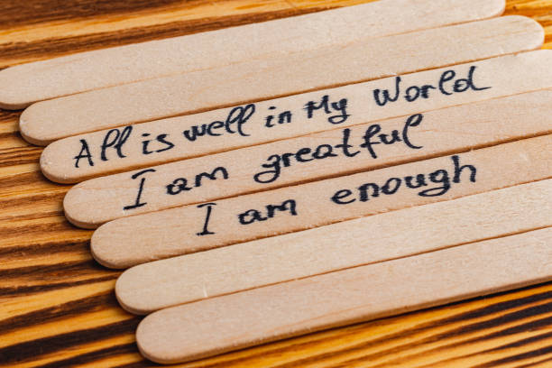 istock Positive thoughts for increasing selfesteem on wooden posts on wooden background 2187652871