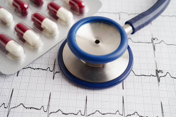 istock Stethoscope on electrocardiogram ECG with capsule drug, heart wave, heart attack, cardiogram report. 2187652954