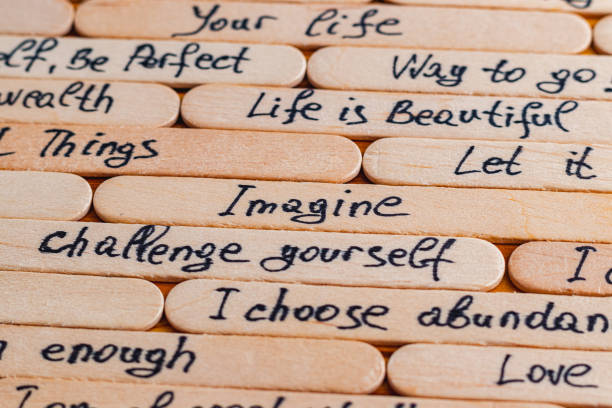 Positive thoughts for increasing selfesteem on wooden posts on wooden background High quality photo.