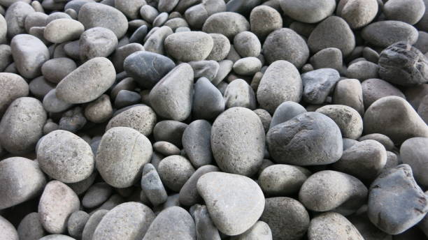 istock The background of pebbles arranged into a background 2187654273
