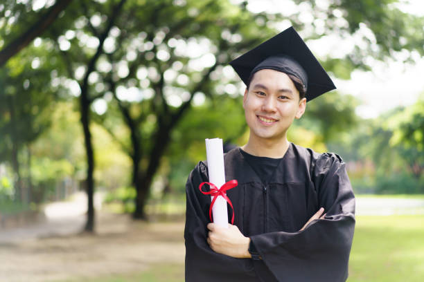 istock Happy and excited graduated students in their graduation ceremony. 2187655911