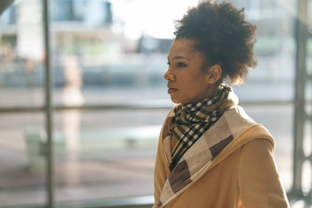 istock African American walking through office building glass corridor 2187658853