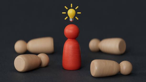 istock Wooden figure with drawing light bulb on cube among other wooden with question mark , Problem solving and creative idea concept.3D rendering on black background. 2187659645