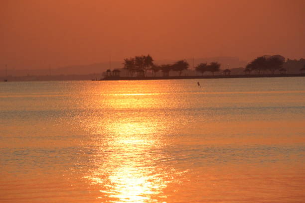 reddish orange sunrise on the morning beach