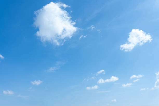 istock Sunny Day Blue Sky with Fluffy White Clouds Background 2187662543