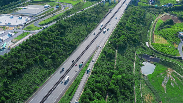 istock Modern highway in the forest aerial view. 2187662597