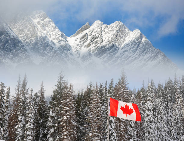 istock Canadian flag and Rocky mountains. 2187664091
